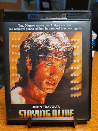 Staying Alive [4K/UHD + Blu-ray w/ Slipcover] *PRE-OWNED*