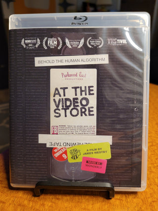 At the Video Store [Blu-ray w/ Limited Edition Slipcover] *PRE-OWNED*